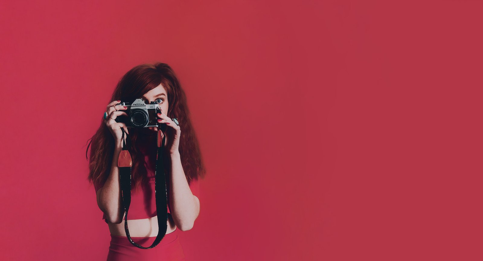 Hebah, the photographer behind Momentos by Hebah, holding a film camera