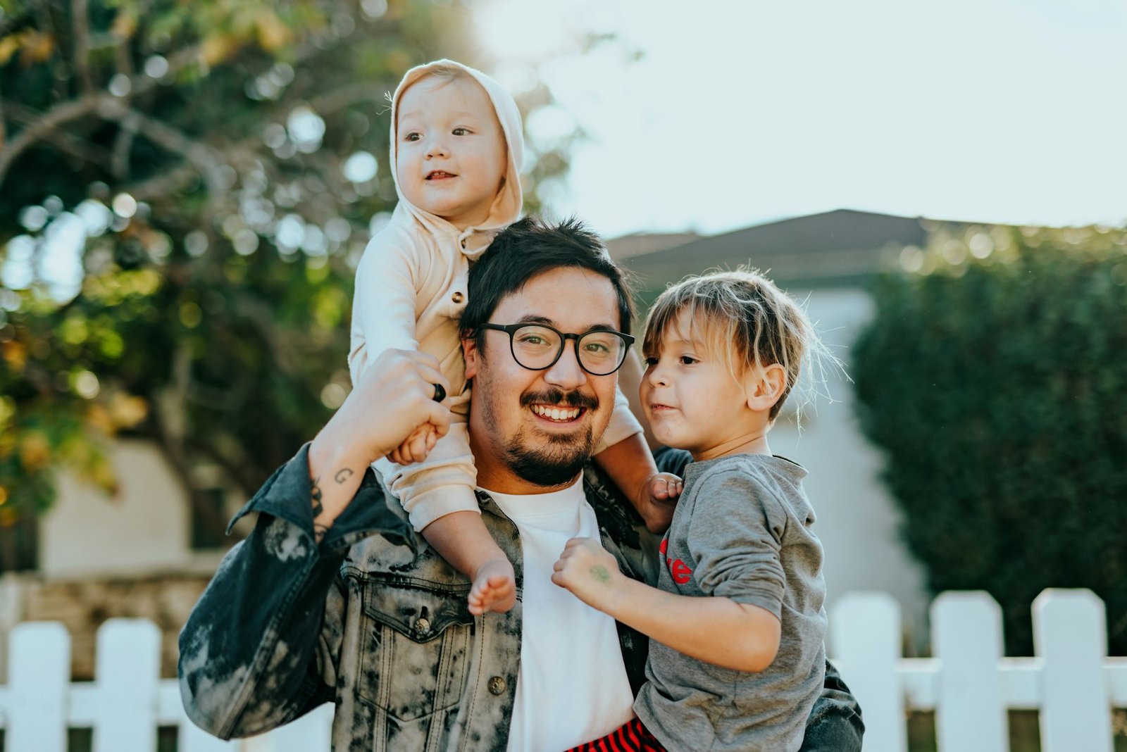 Father carrying his two children outdoors – family photography session in Liberty Township, Ohio